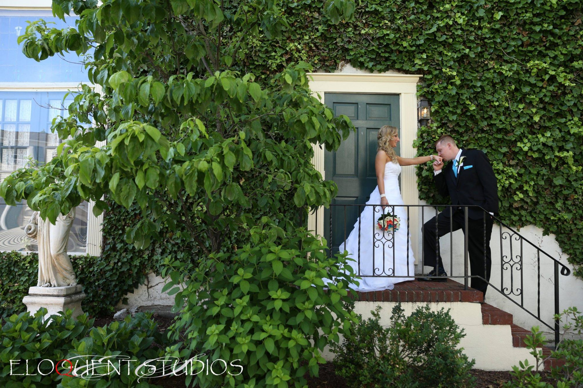 David’s Country Inn kissing the bride's hand at the door