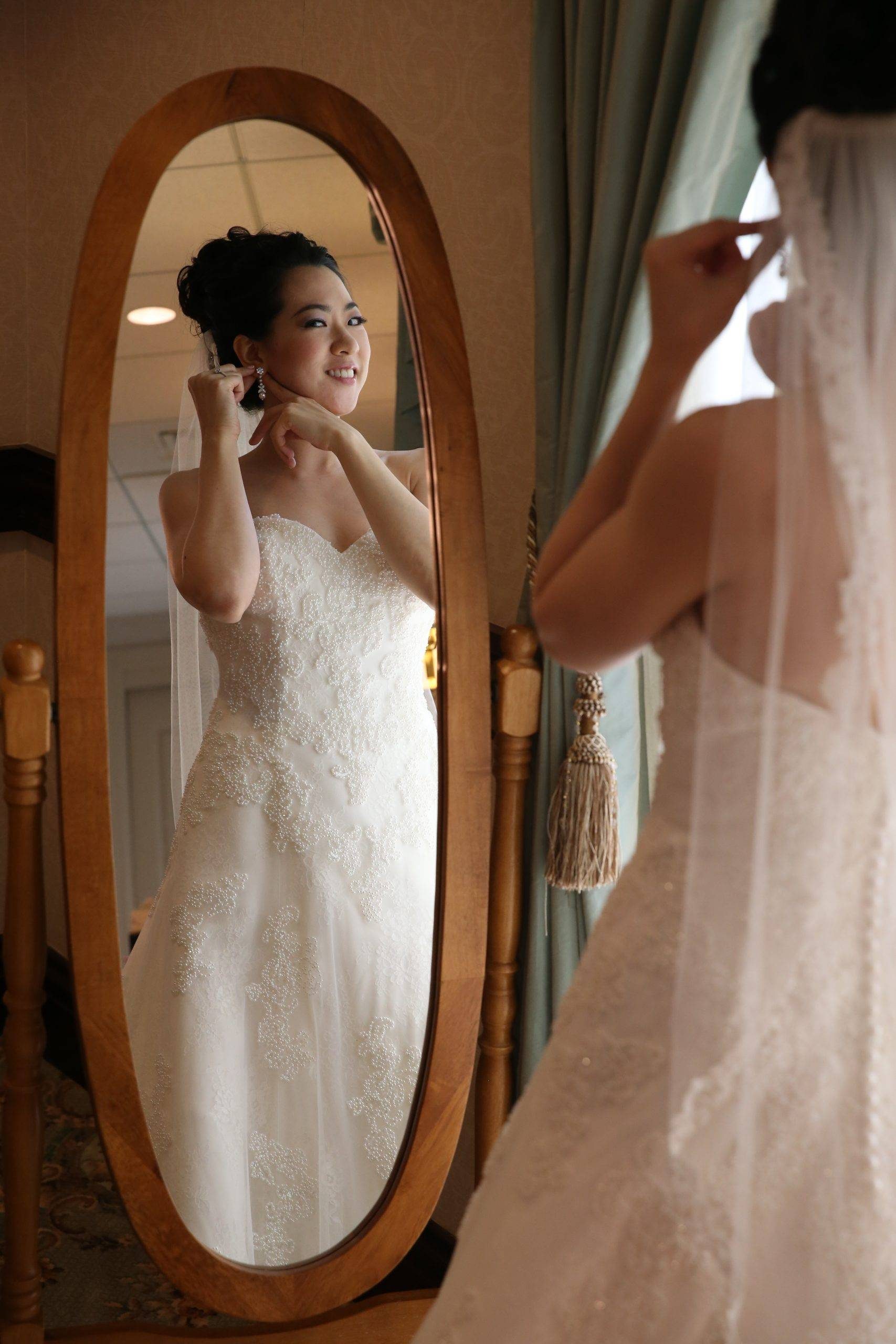 Brooklake bride getting ready in mirror