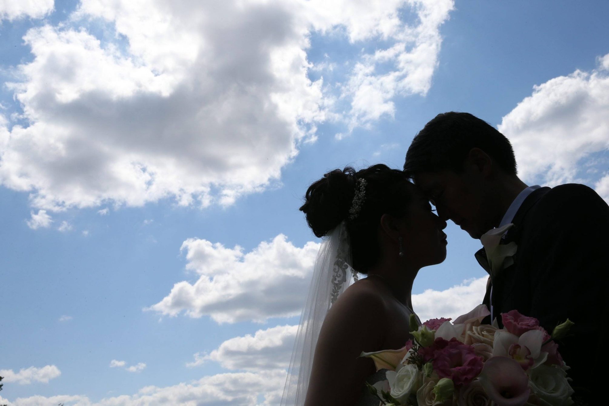 Brooklake bride and groom with the blue sky