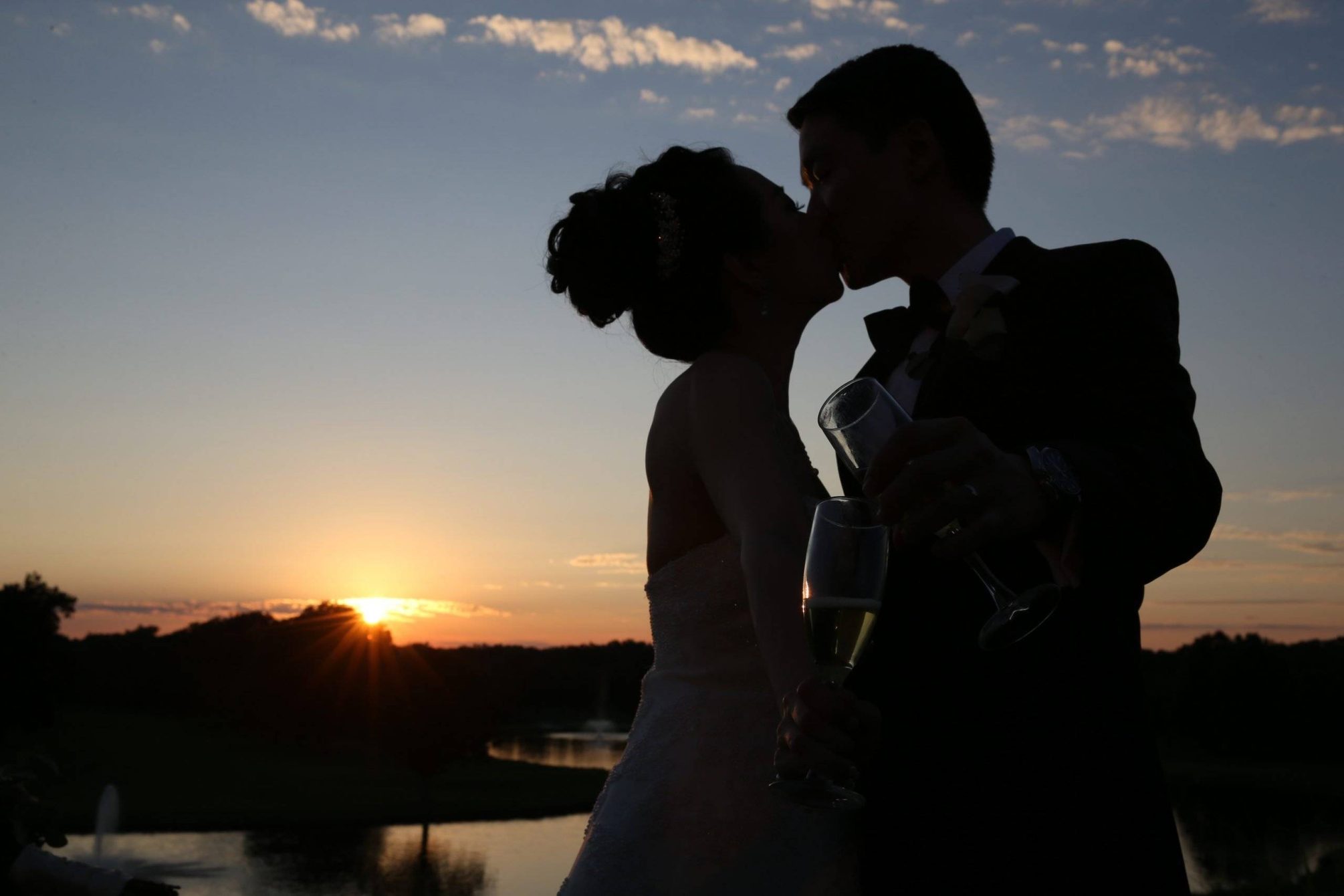 Brooklake wedding kiss with sunset by the lake