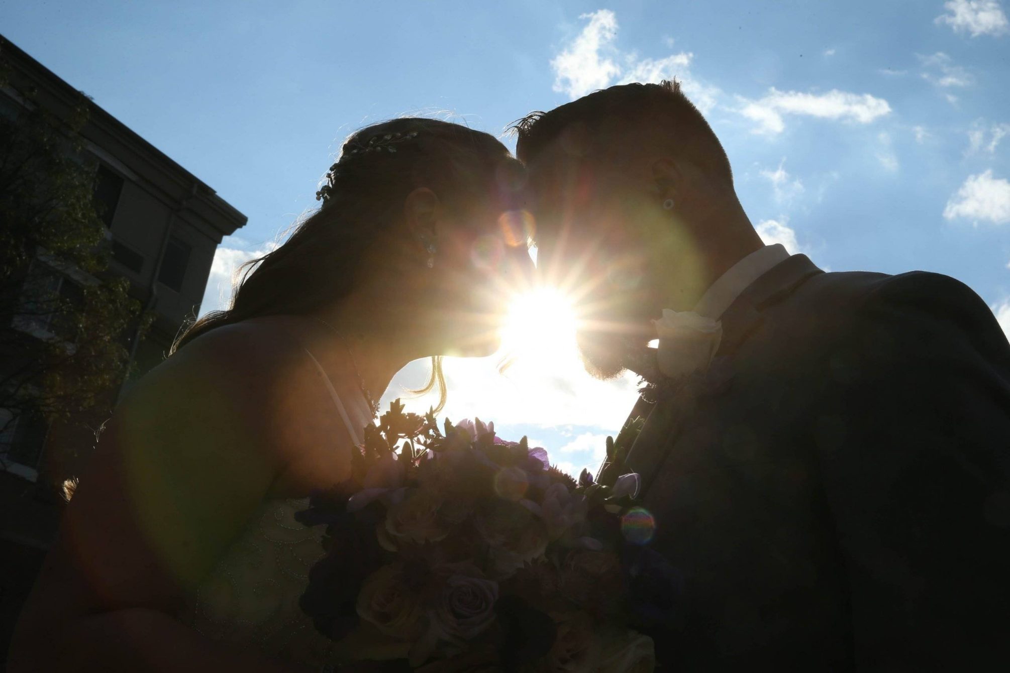 Primavera Regency wedding couple with the sun peaking through their profiles