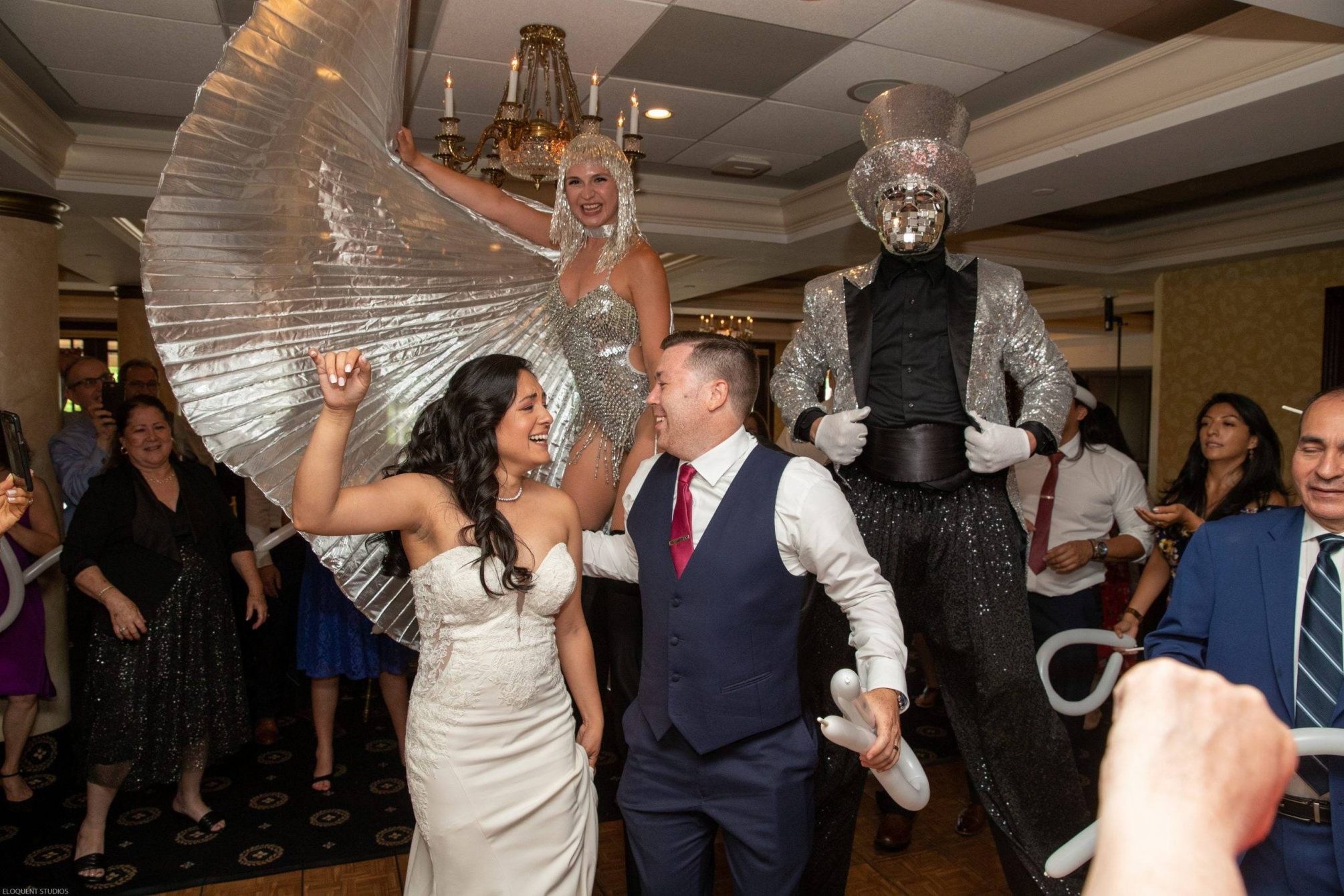 Brooklake bride and groom on dance floor with stilt walkers