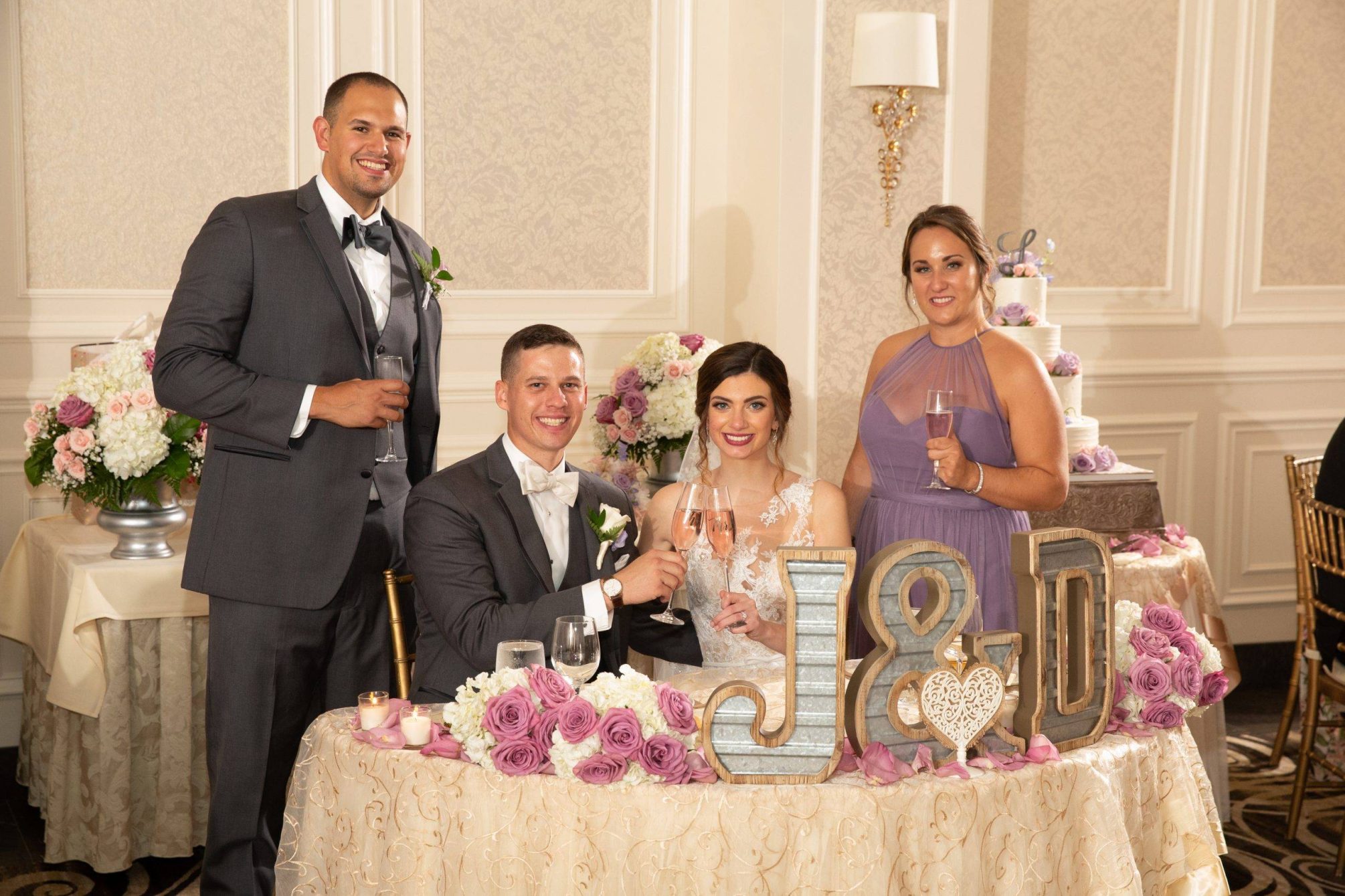 Meadow Wood wedding couple with best man and maid of honor