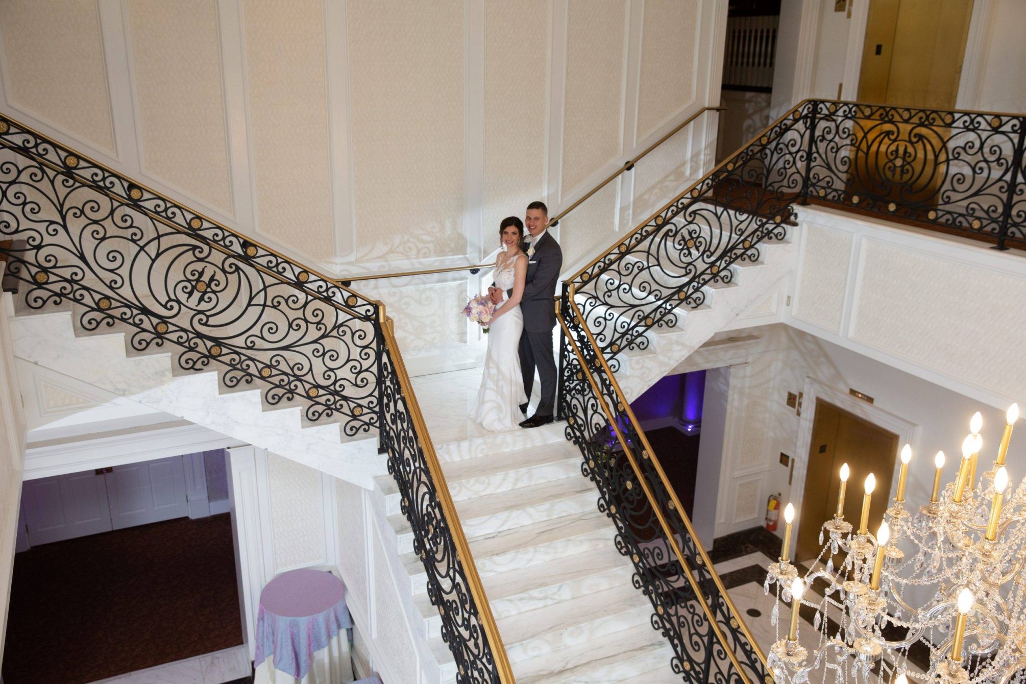 Meadow Wood wedding couple on staircase from above
