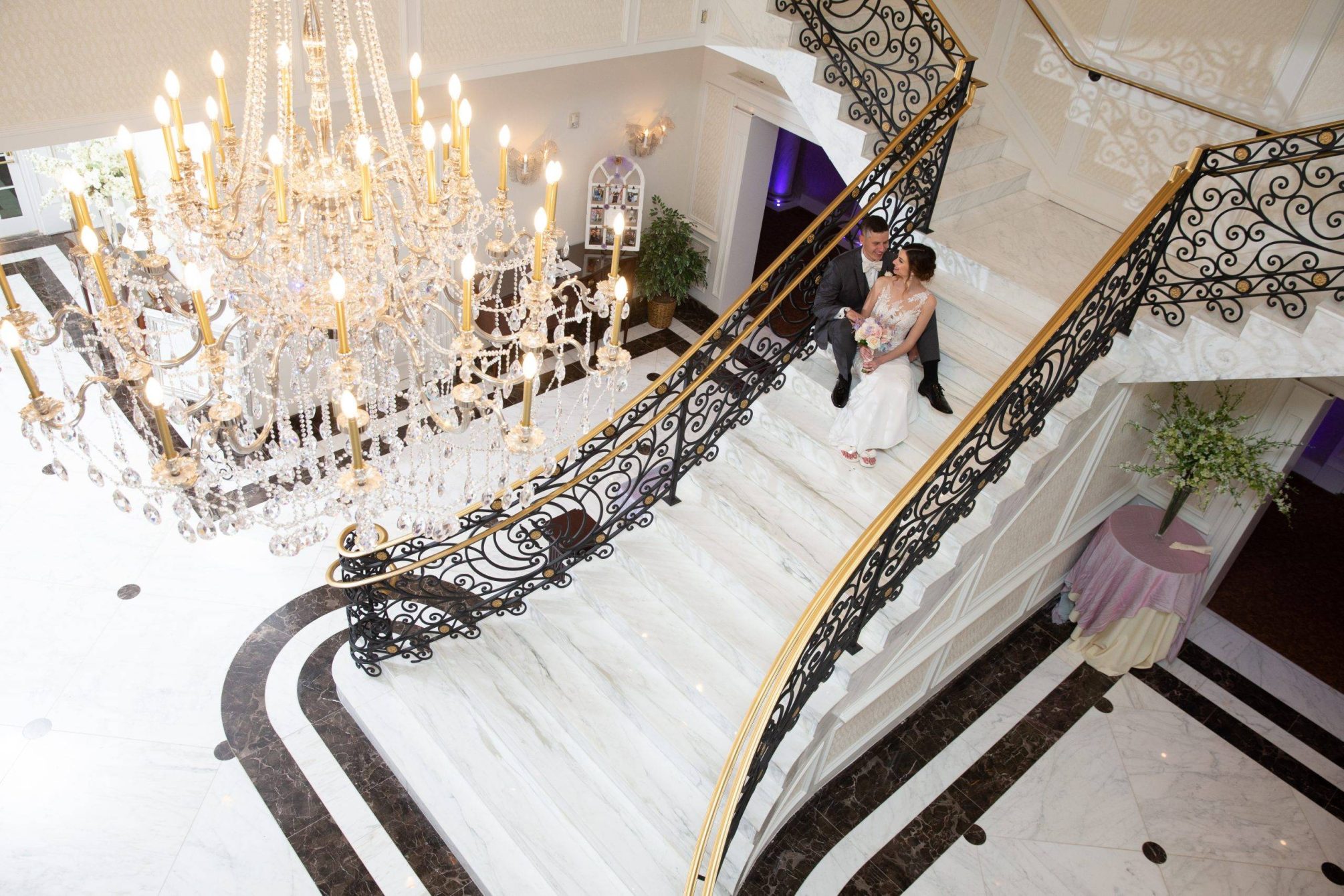 Meadow Wood wedding couple sitting on staircase from above