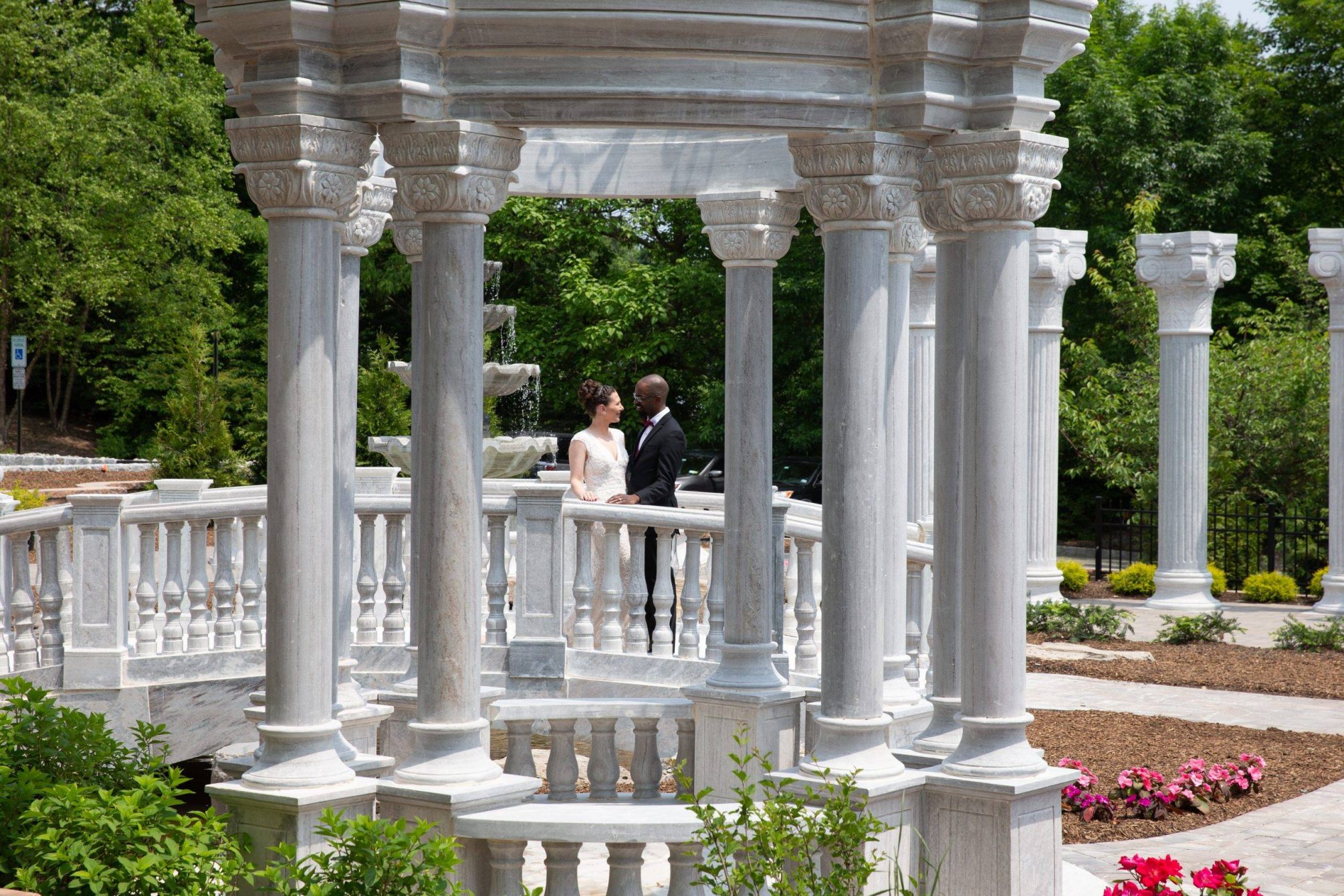 Meadow Wood wedding couple outside by columns and gazebo