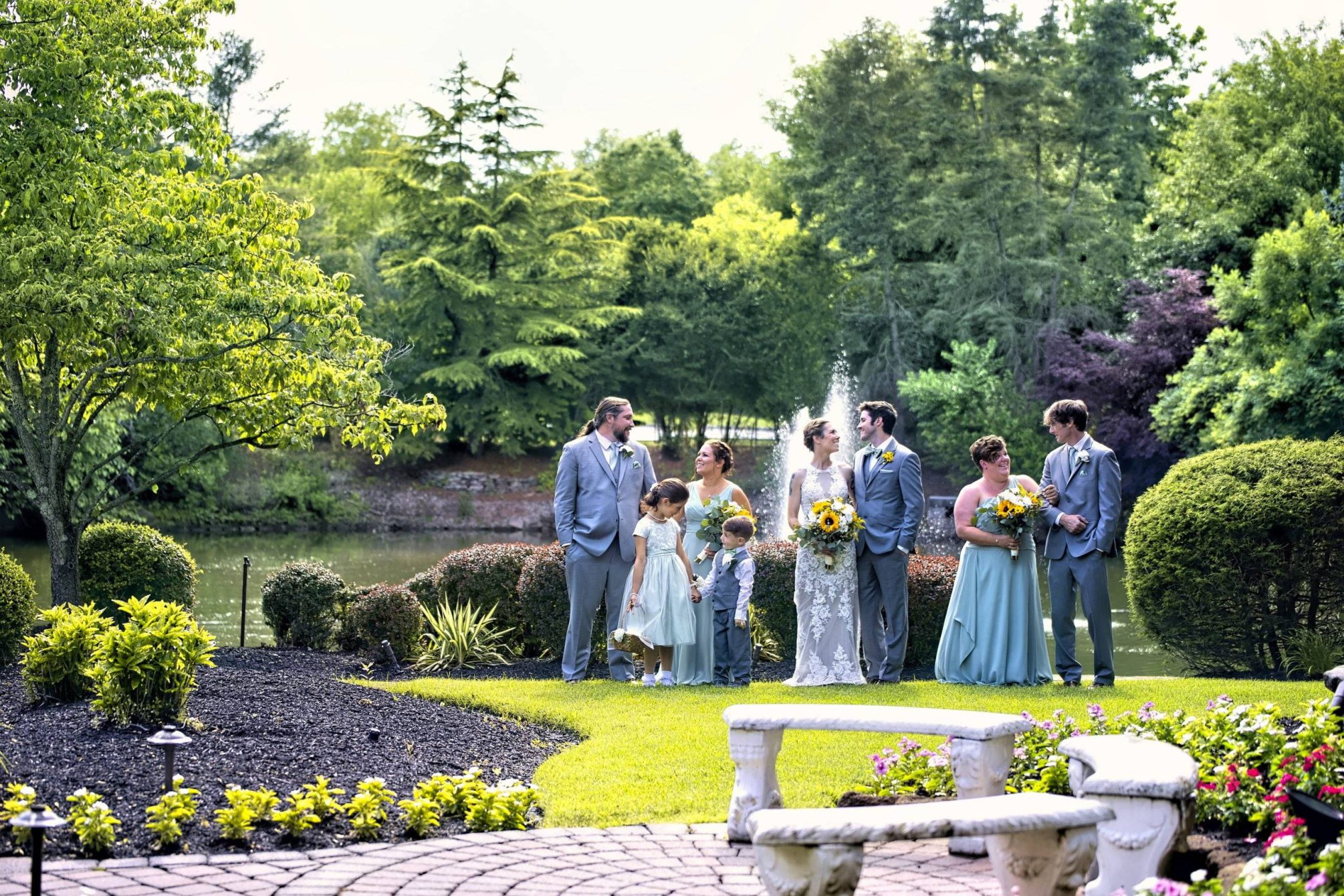 Bridgewater Manor wedding party in gardens by fountain