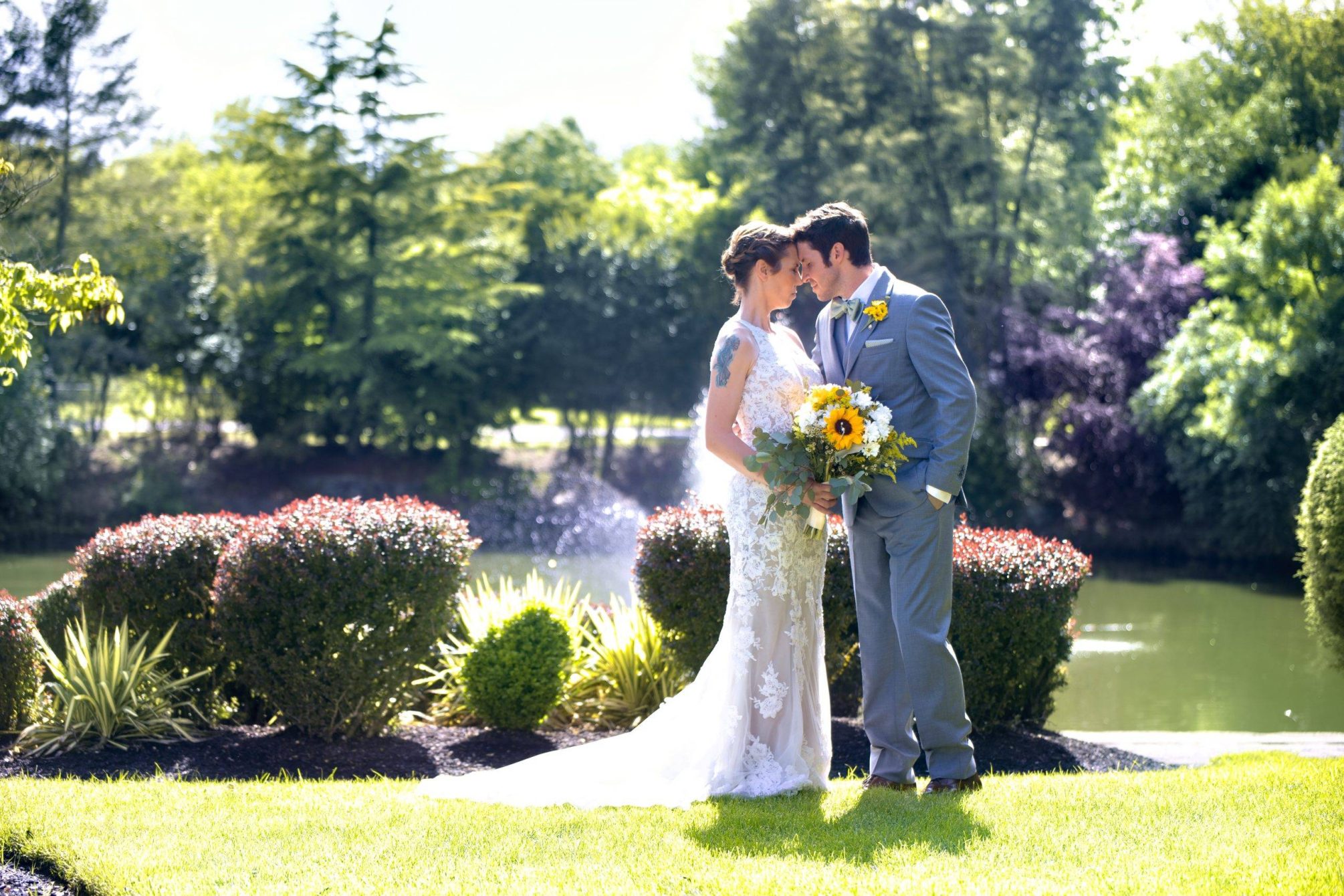 Bridgewater Manor bride and groom in gardens by fountain