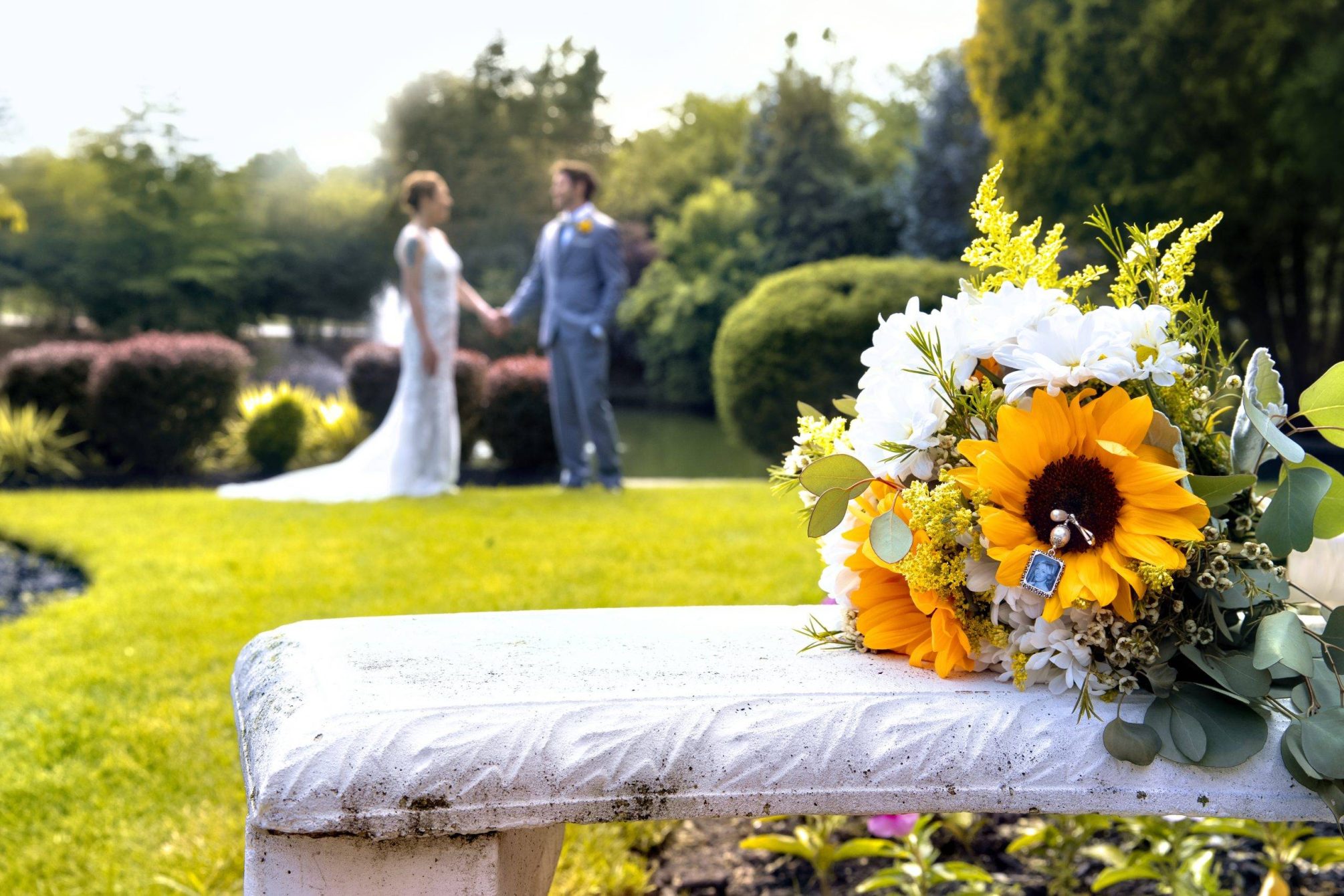 Bridgewater Manor bride and groom holding hands in gardens